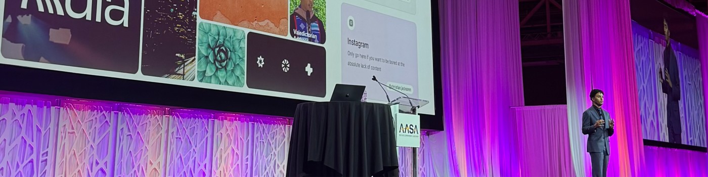 Christian Jackson at the AASA podium, wide stage view